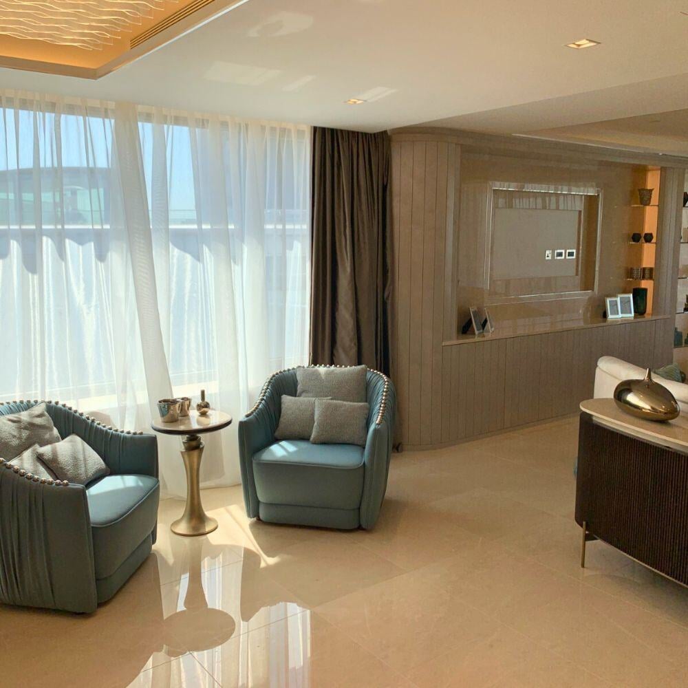 Elegant seating area with natural light and bespoke joinery.