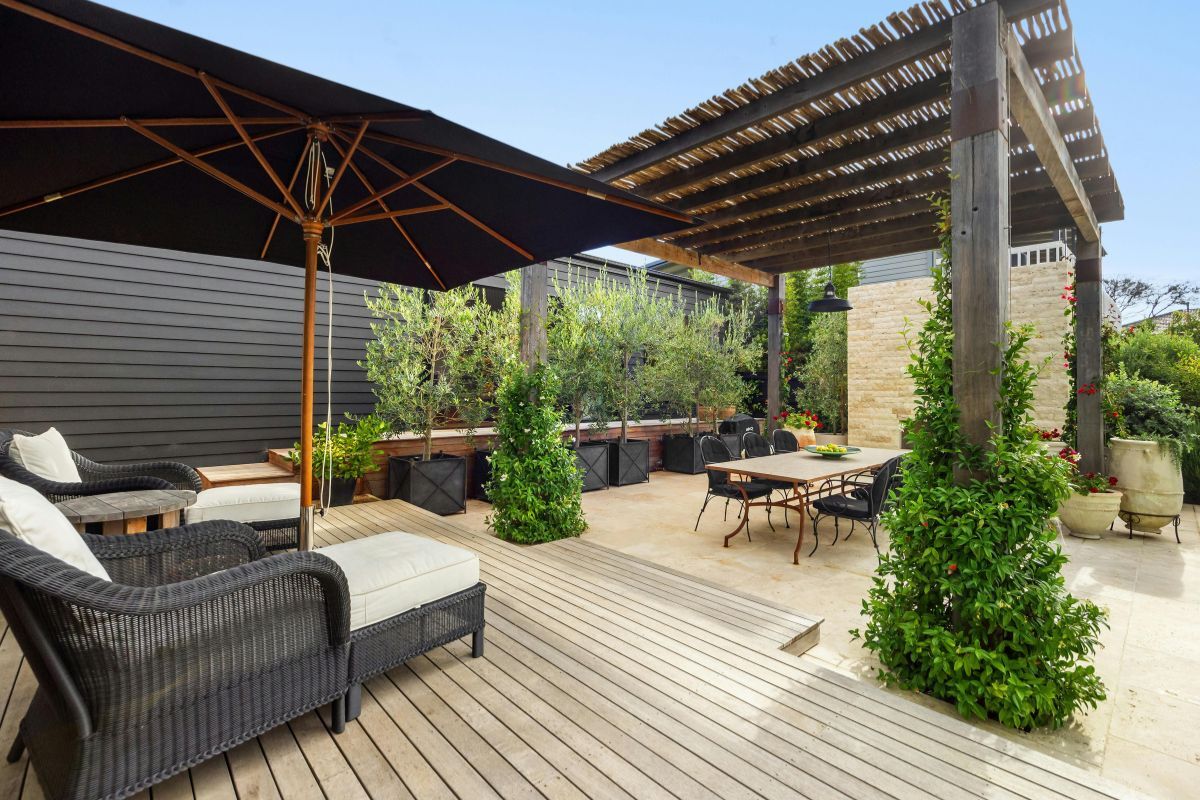 Wooden outdoor decking with modern garden furniture