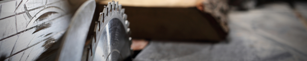 Close-up of a hand working on bespoke joinery